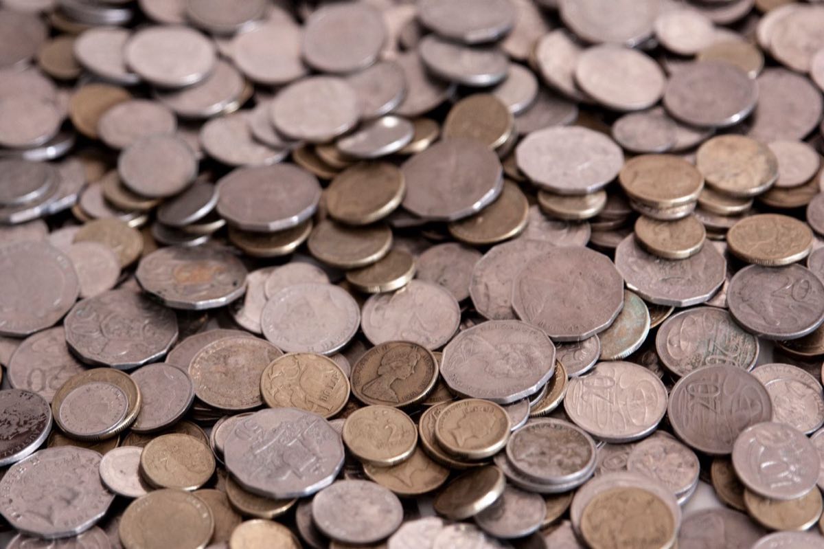 A large pile of assorted old coins
